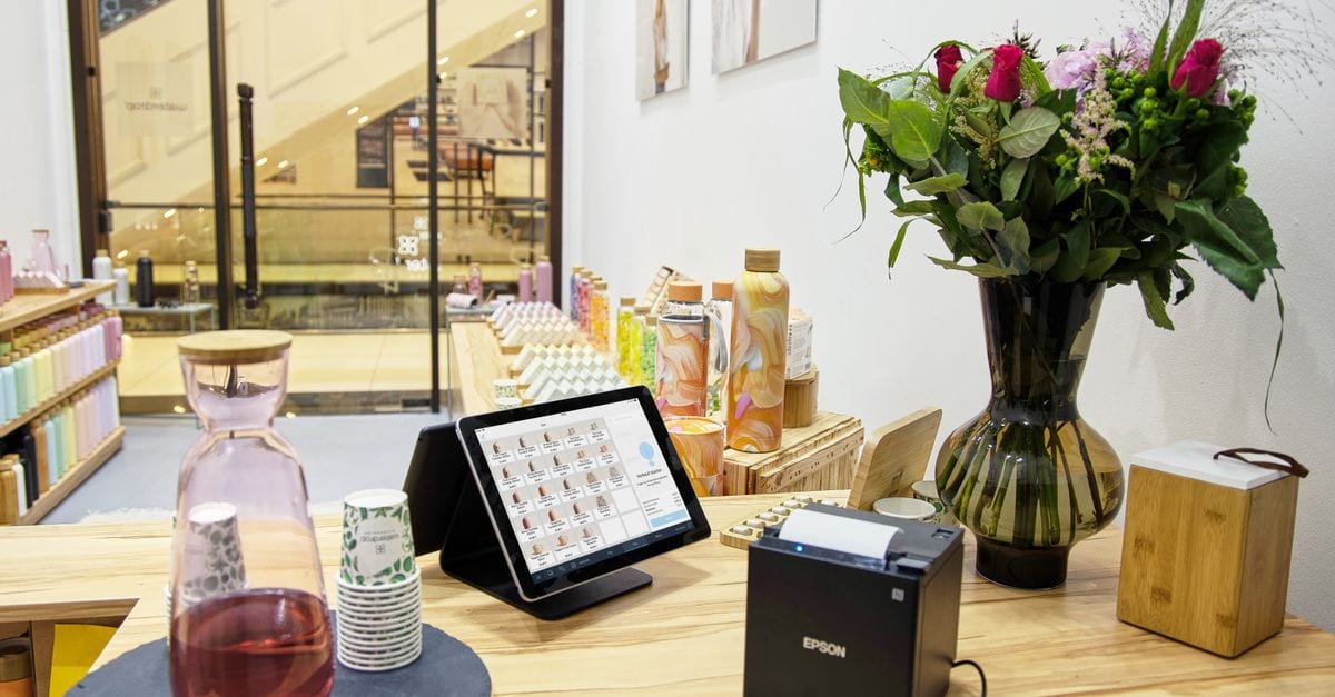Business owner confirming payment setup on a tablet